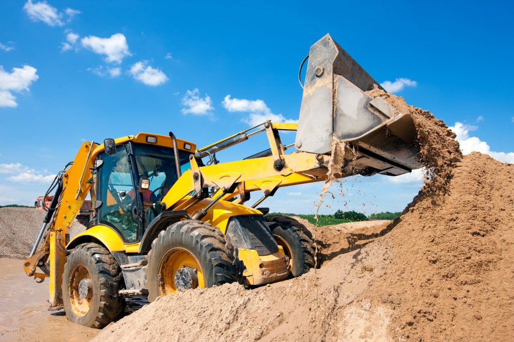 Alat berat kondisi ekstrim extreme sungai wheel loader